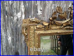 Ancien grand miroir mural de style Louis XVI en bois et platre glace biseautée