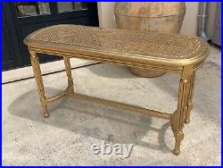 Banquette piano cannée en bois doré de style Louis XVI