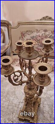 Beautiful pair of Louis XVI style candlesticks in gilded bronze/brass/regule