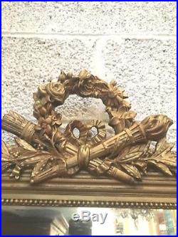 Glace de style Louis XVI en bois et stuc doré / Miroir / Trumeau