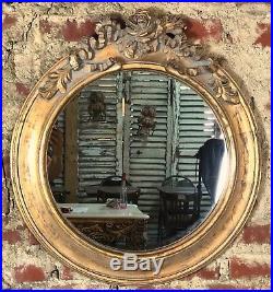 Glace / miroir rond style Louis XVI à décors de roses bois et stuc patiné doré