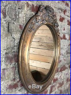 Glace / miroir rond style Louis XVI à décors de roses bois et stuc patiné doré