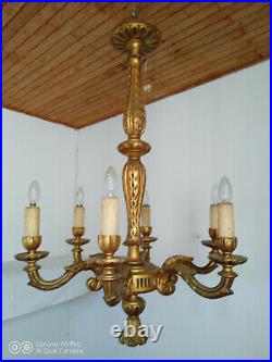 Grand lustre en bois sculpté doré style Louis XVI