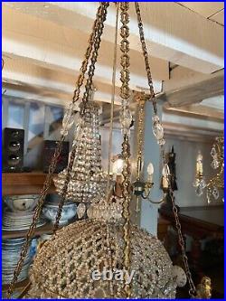 Grand lustre en bronze et pampilles de cristal de style Louis XVI