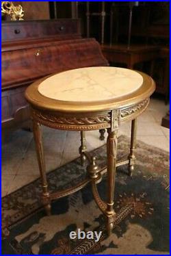 Guéridon table de milieu en bois doré de style Louis XVI