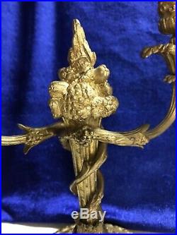 Paire de Bougeoirs style Louis XVI en bronze
