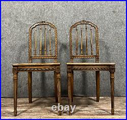 Paire de chaises de style Louis XVI en noyer à dossiers ajourés vers 1880