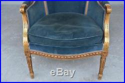 Paire de fauteuils bergères laqués dorés style Louis XVI époque 1900