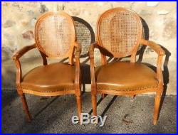 Paire de fauteuils cabriolet de style Louis XVI cannage et cuir
