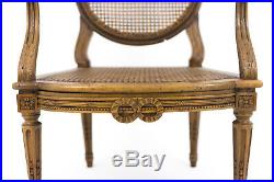 Paire de fauteuils cannés de style Louis XVI en noyer, XIXe siècle