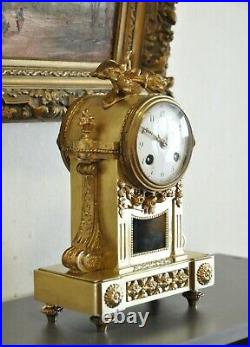 Pendule bronze style Louis XVI