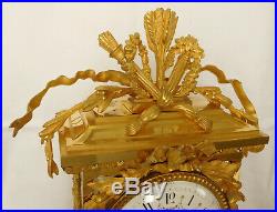 Pendule cage XIXe de style Louis XVI en bronze ciselé et doré et marbre griotte