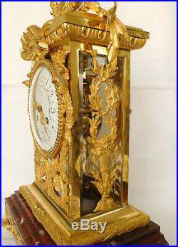 Pendule cage XIXe de style Louis XVI en bronze ciselé et doré et marbre griotte