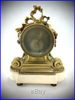 Pendule complète en bronze doré sur socle marbre style Louis XVI