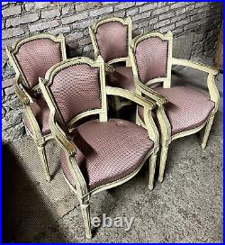 Rare série de quatre fauteuils de style Louis XVI en bois mouluré laqué blanc