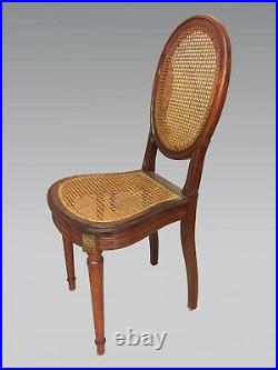 Six chaises cannées style Louis XVI acajou