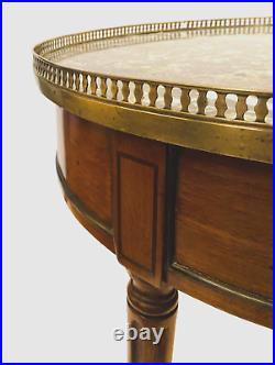 Table bouillote de style Louis XVI en acajou dessus marbre gris SA. XX siècle