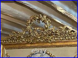 Trumeau style Louis XVI en bois et stuc doré décor aux Amours fin XIXe début XXe